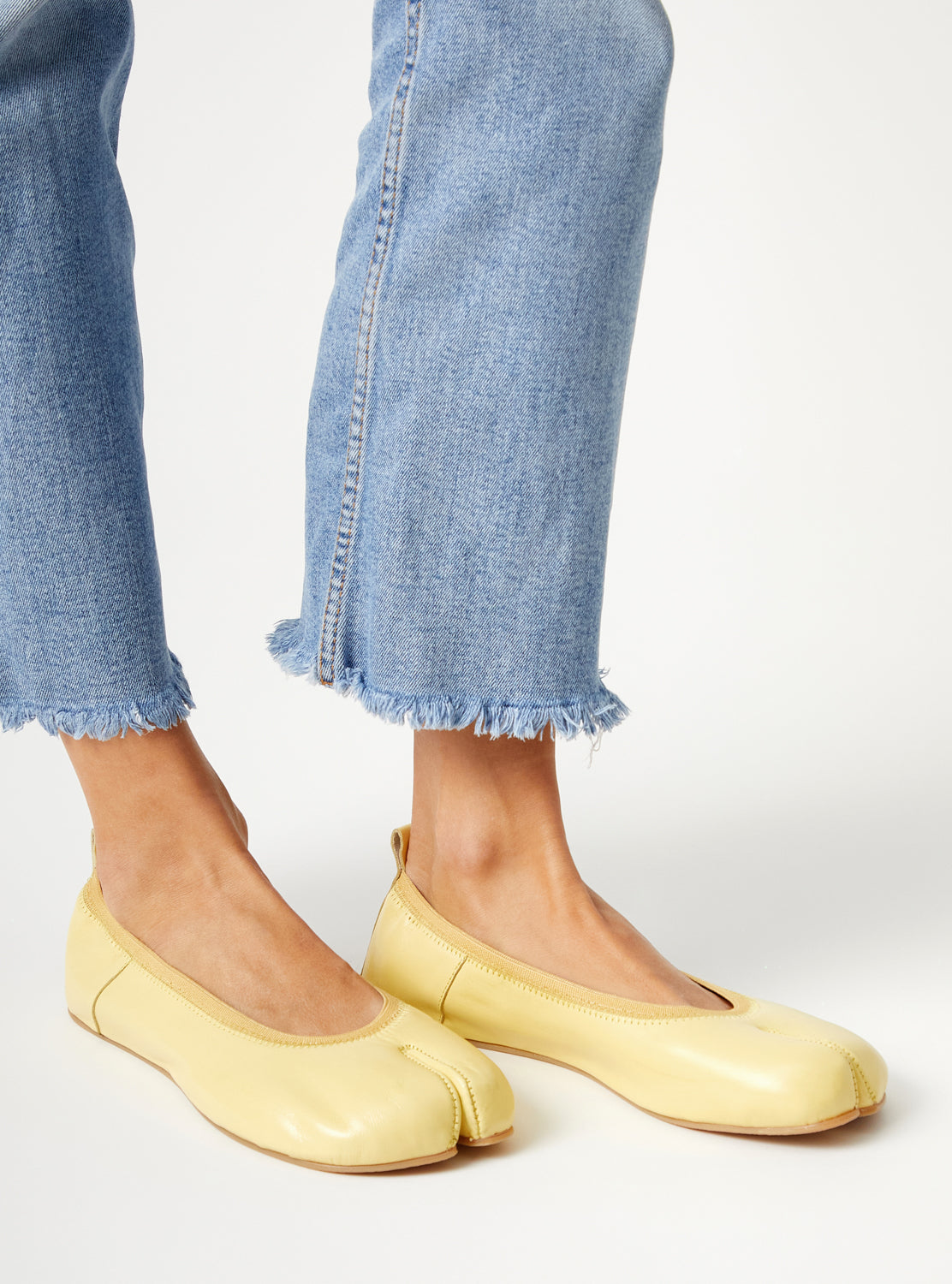 Barefoot yellow ballerinas