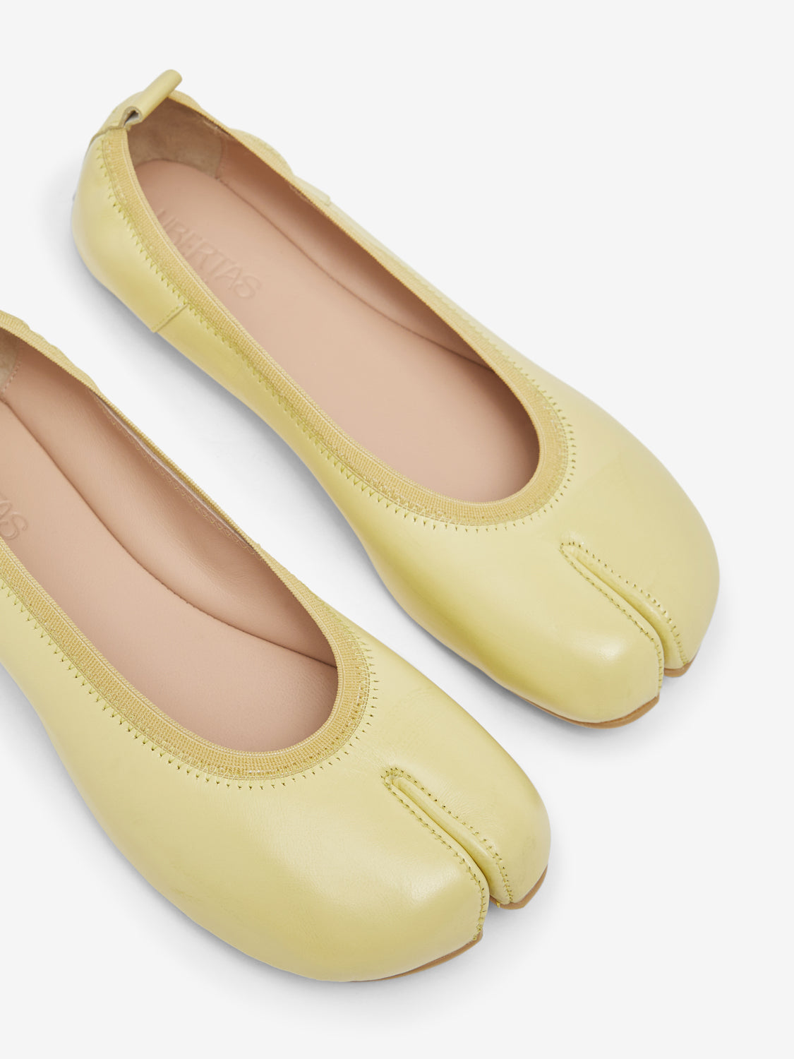 Barefoot yellow ballerinas