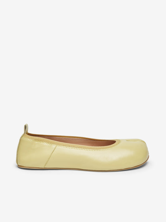 Barefoot yellow ballerinas