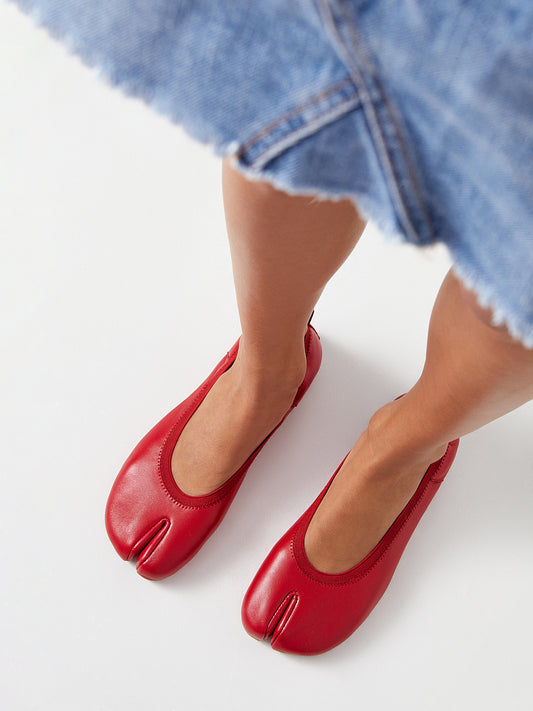 Barefoot red ballerinas